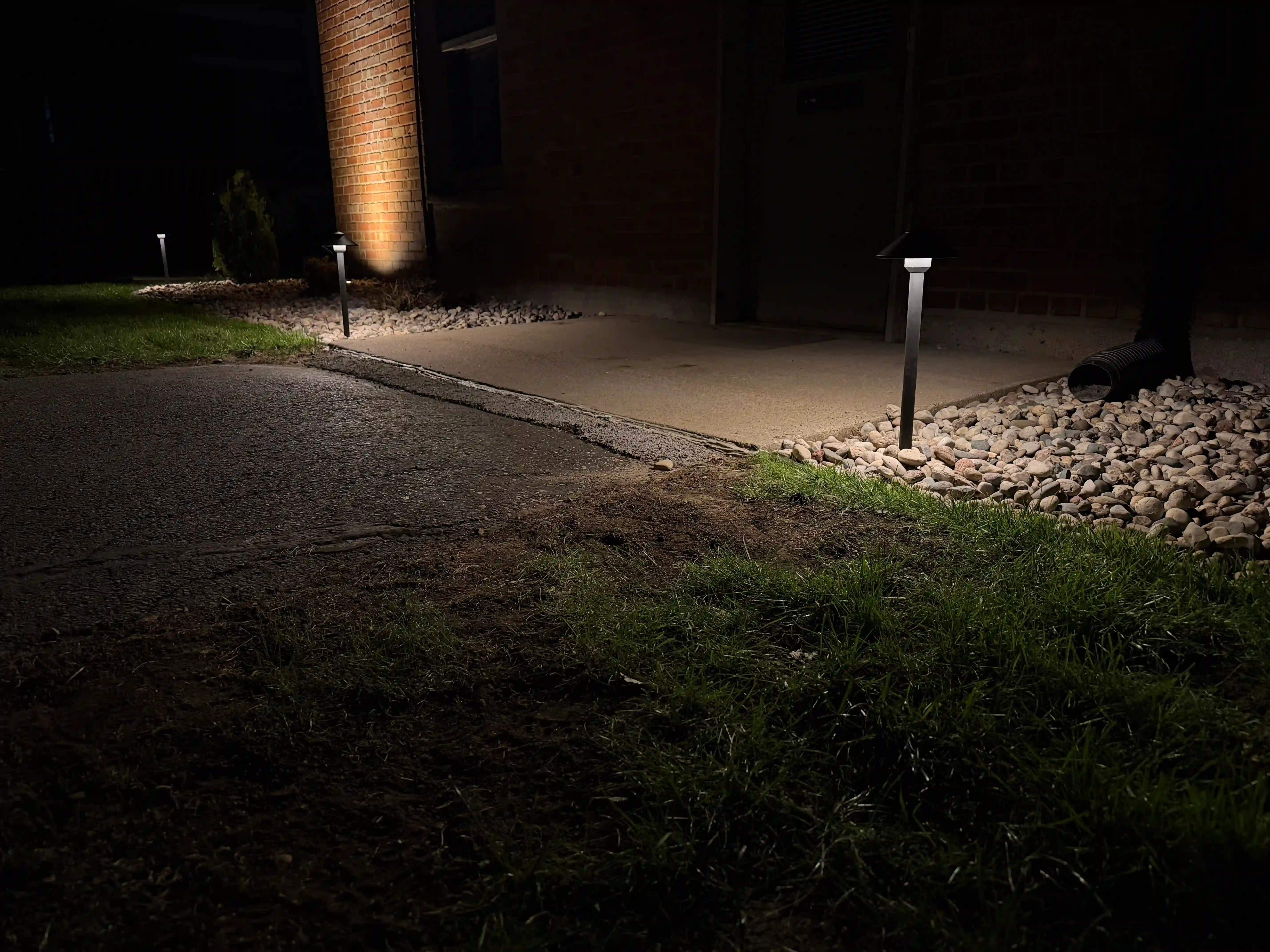 Completed outdoor lighting project illuminating residential property